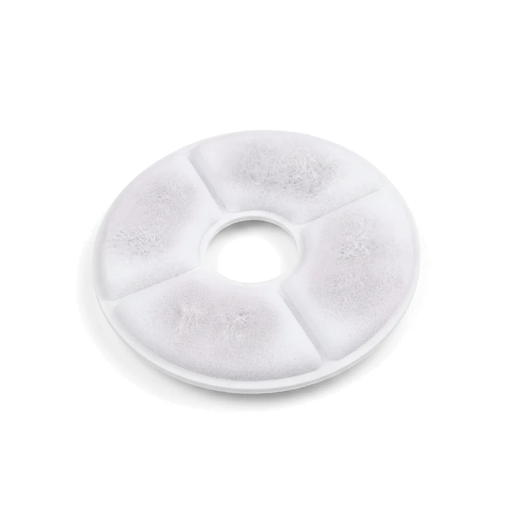 Disque de filtre blanc posé à plat sur fond clair